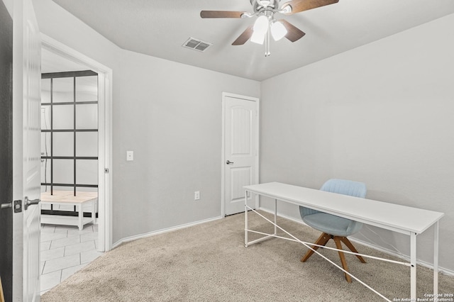 office featuring ceiling fan and light colored carpet