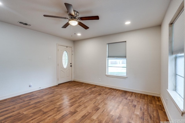 foyer entrance with ceiling fan and hardwood / wood-style flooring