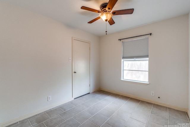 spare room with ceiling fan