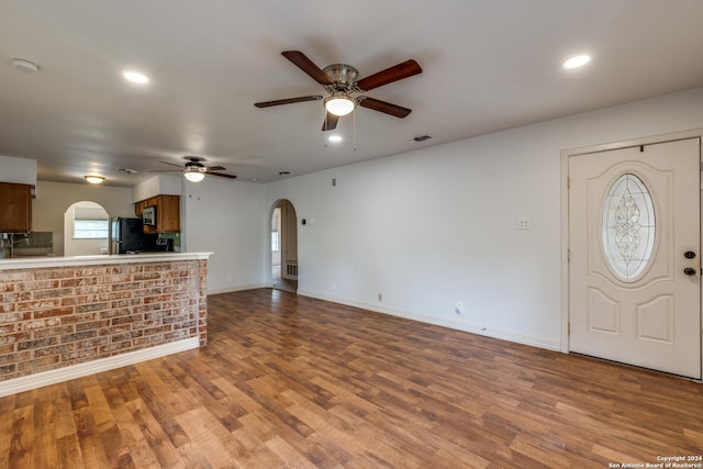 interior space with ceiling fan and hardwood / wood-style floors