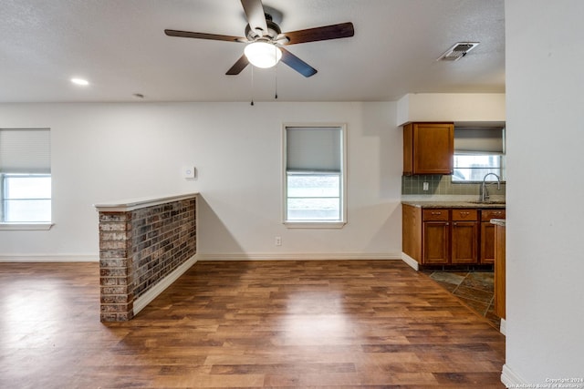 kitchen with tasteful backsplash, ceiling fan, dark hardwood / wood-style flooring, and sink