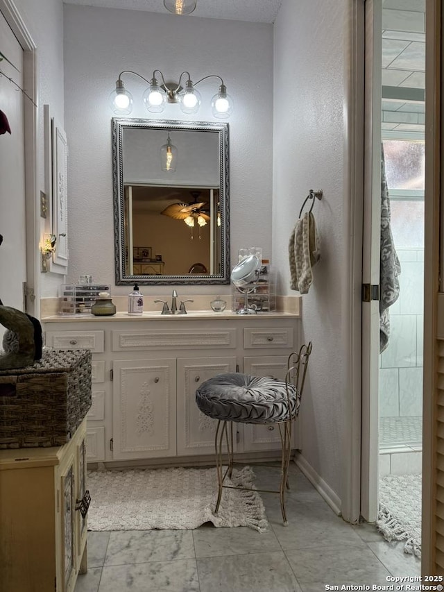 bathroom with vanity and tile patterned flooring