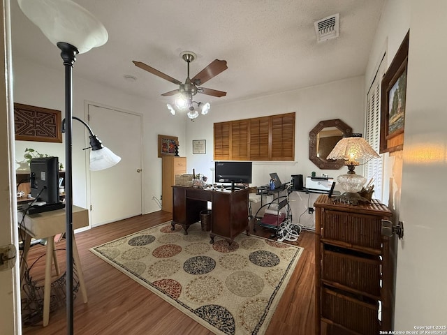 office area with ceiling fan and dark hardwood / wood-style floors