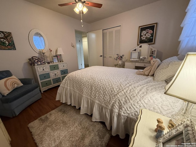 bedroom with ceiling fan, a closet, and dark hardwood / wood-style flooring