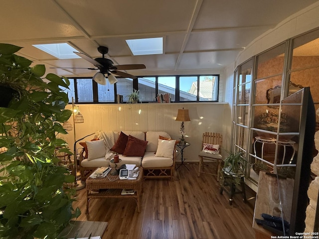 sunroom featuring ceiling fan