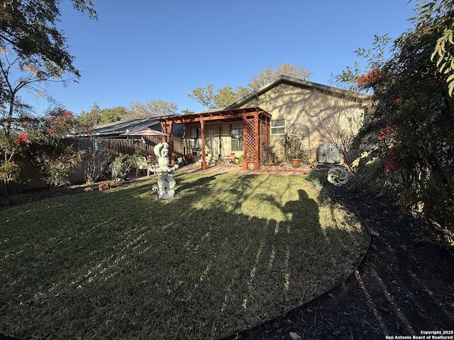 exterior space featuring a pergola and a lawn