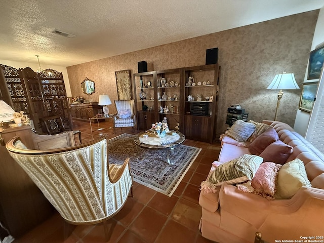 living room featuring a textured ceiling and dark tile patterned floors