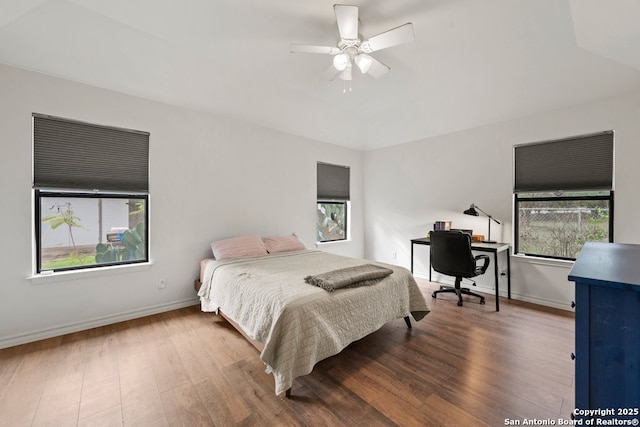 bedroom with ceiling fan and hardwood / wood-style floors