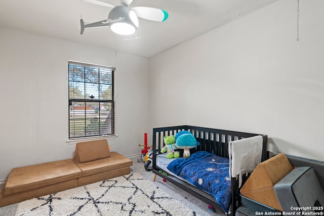 carpeted bedroom with ceiling fan