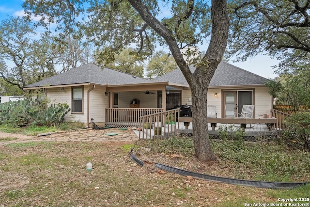 view of front of property with a wooden deck and ceiling fan