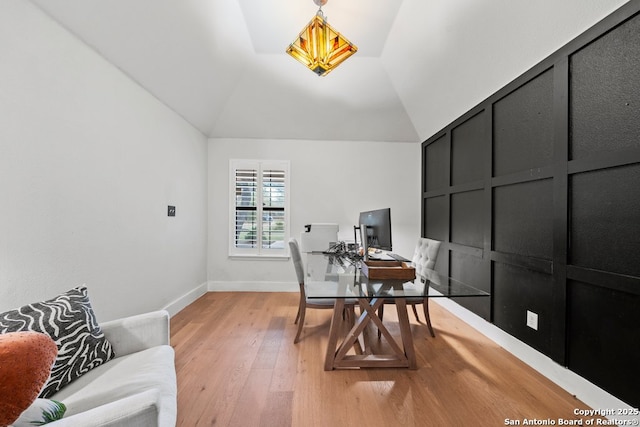 office space with lofted ceiling and light hardwood / wood-style floors