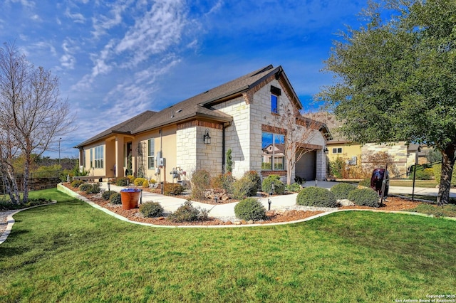 view of side of home featuring a garage and a lawn