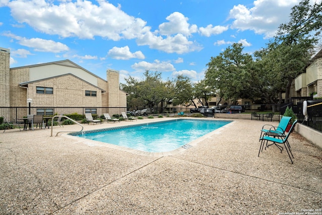 view of swimming pool featuring a patio area