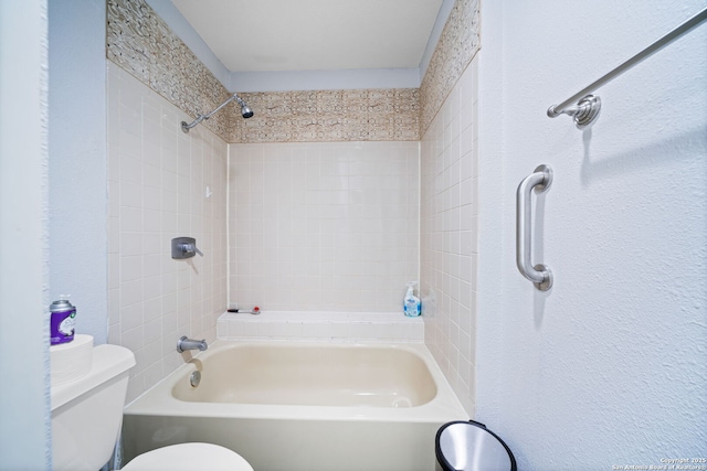 bathroom featuring shower / bath combination and toilet