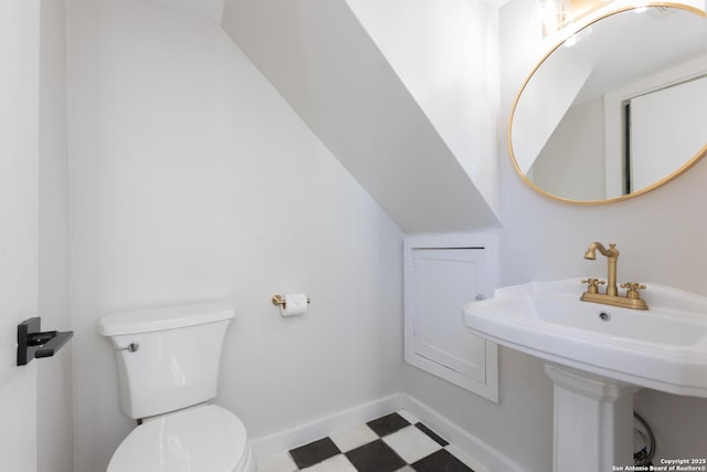 bathroom featuring sink and toilet