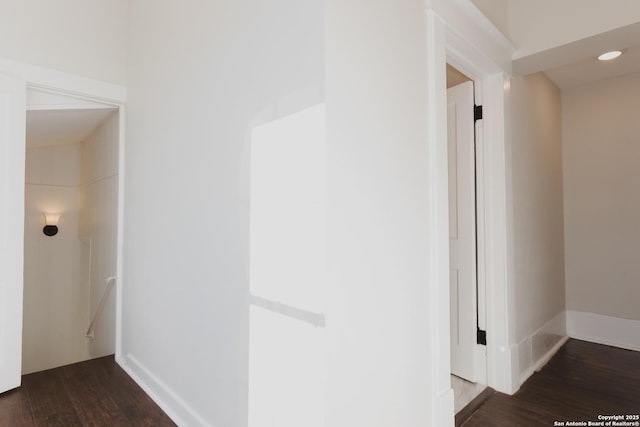 hallway with dark wood-type flooring