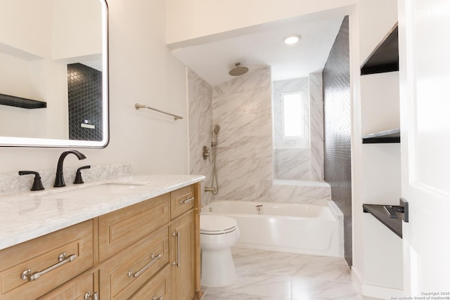 full bathroom featuring toilet, tiled shower / bath combo, and vanity