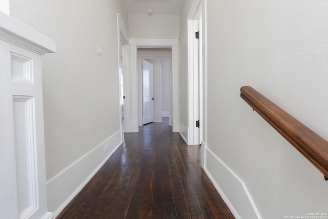 corridor featuring dark hardwood / wood-style floors