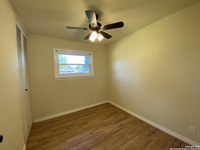 spare room featuring ceiling fan and hardwood / wood-style flooring