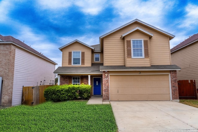 front of property featuring a garage and a front yard