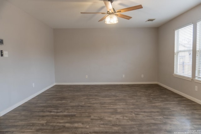 unfurnished room with ceiling fan and dark hardwood / wood-style floors