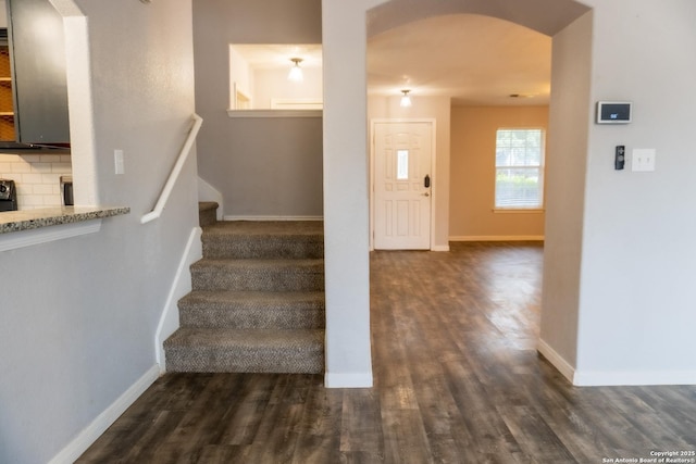 stairway featuring hardwood / wood-style floors