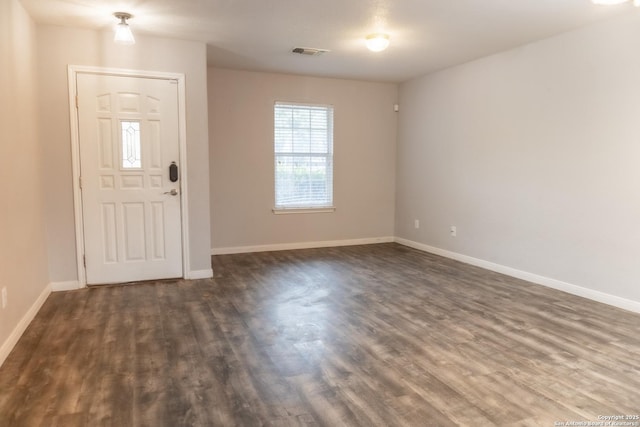 entryway with dark hardwood / wood-style flooring