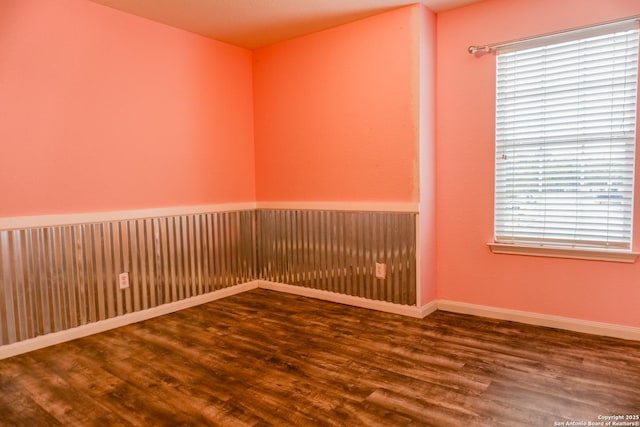 empty room featuring hardwood / wood-style flooring