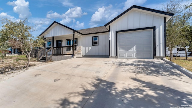 view of front of property with a porch and a garage