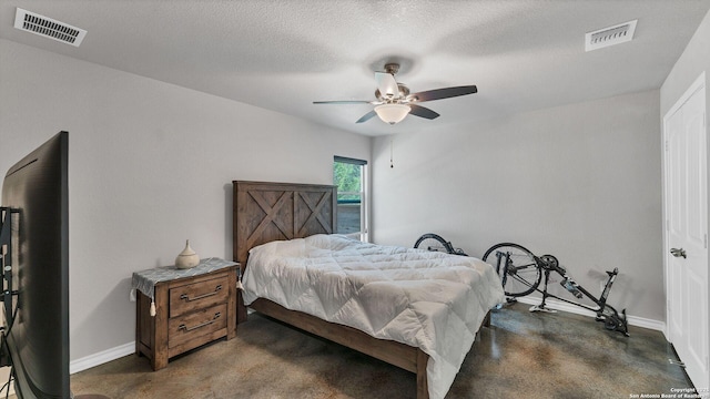 bedroom featuring a textured ceiling and ceiling fan