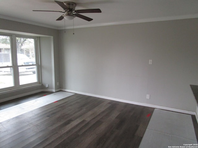 spare room with ceiling fan, dark wood-type flooring, and ornamental molding