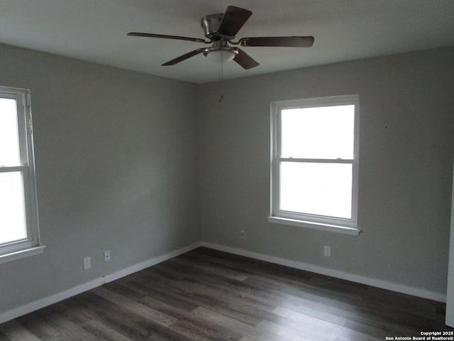 unfurnished room featuring ceiling fan, dark hardwood / wood-style flooring, and a healthy amount of sunlight