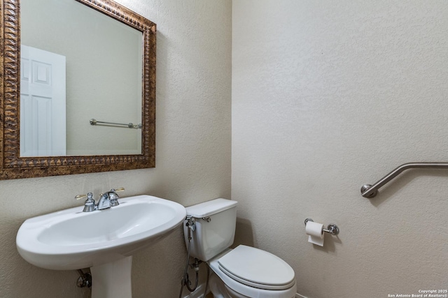 bathroom with sink and toilet