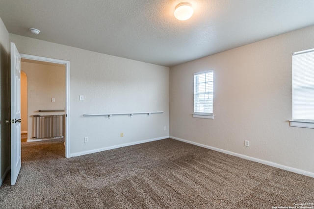 empty room featuring carpet floors