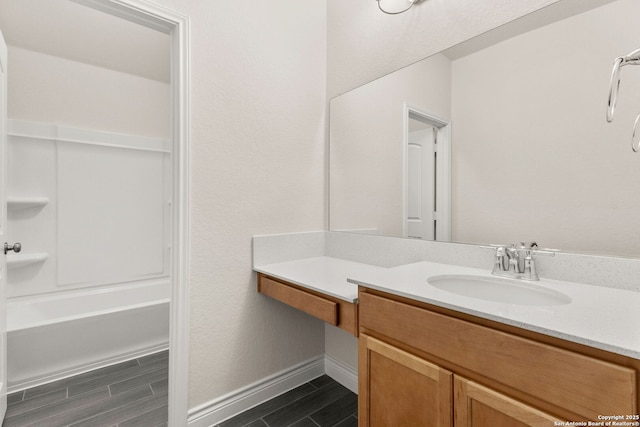 bathroom featuring tub / shower combination and vanity