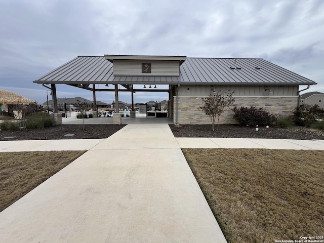 exterior space with a gazebo and a lawn