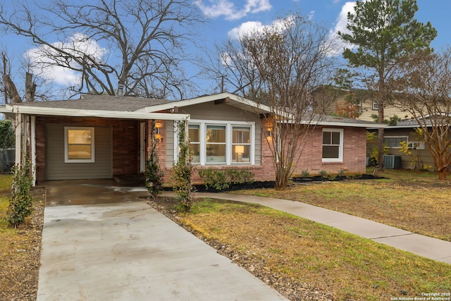 single story home featuring central AC, a carport, and a front lawn