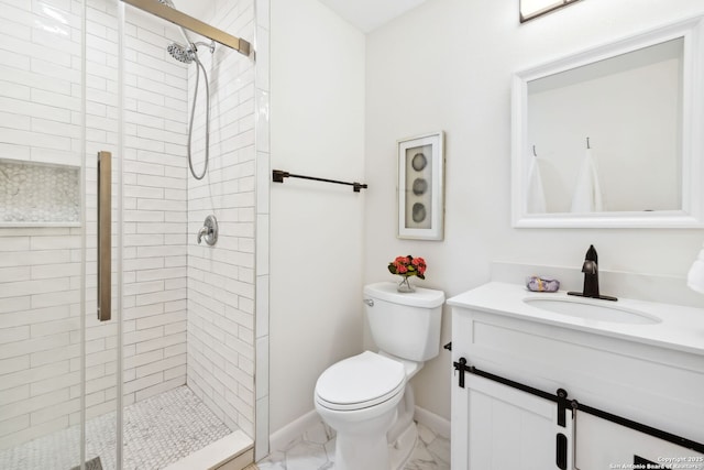 bathroom with vanity, toilet, and walk in shower