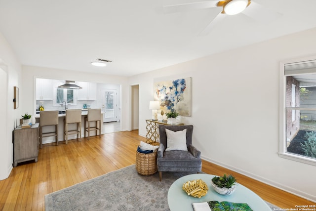 sitting room with light hardwood / wood-style flooring