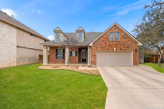 view of front of property featuring driveway, brick siding, a front lawn, and fence