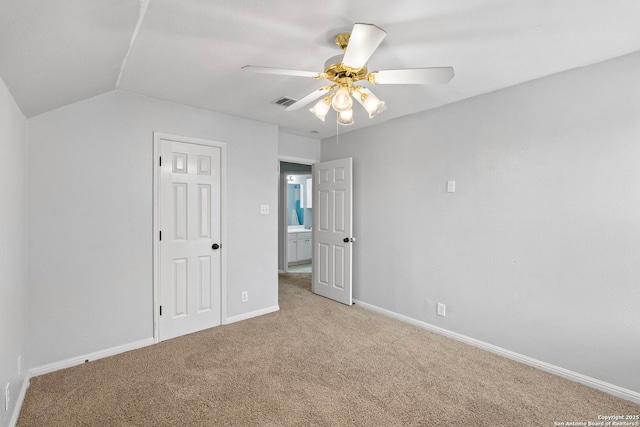 unfurnished bedroom featuring light colored carpet, ceiling fan, visible vents, and baseboards