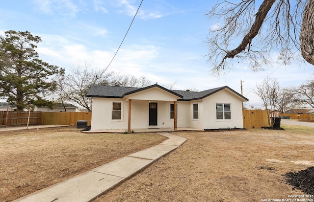 single story home with a front lawn and central AC unit