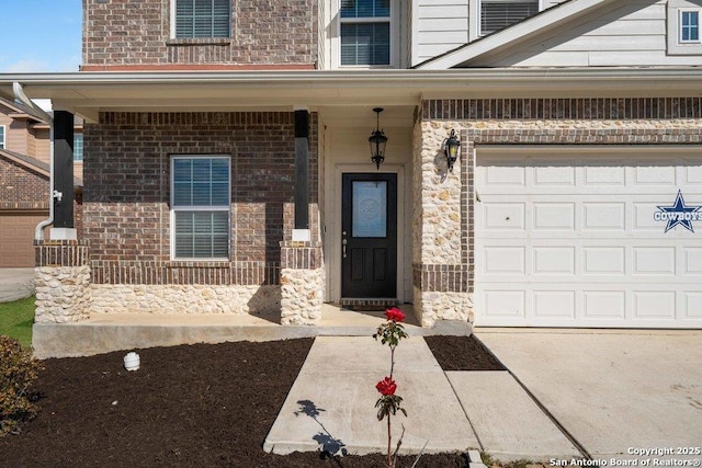 doorway to property with a garage