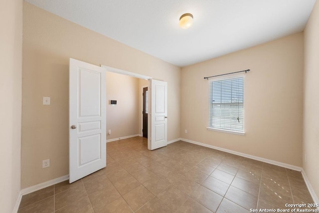 unfurnished bedroom with light tile patterned floors