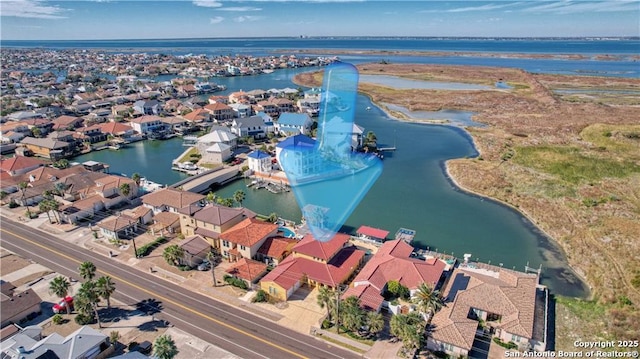 aerial view featuring a water view and a residential view