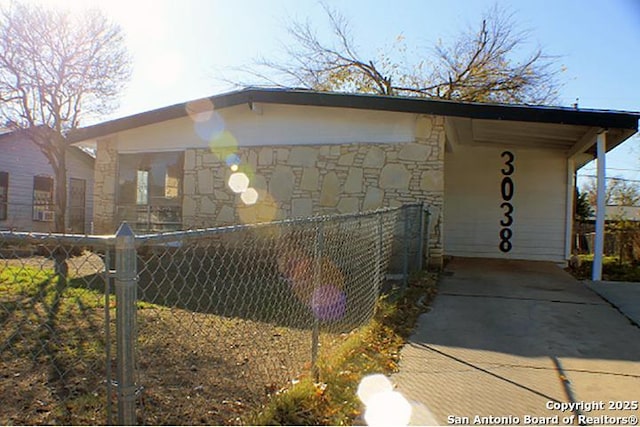 view of property exterior with a carport