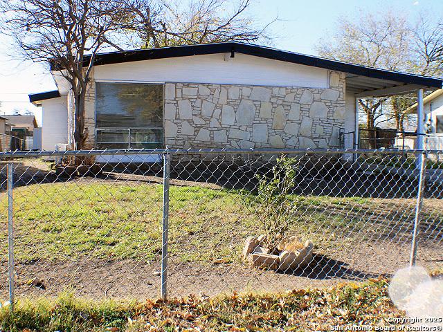 view of home's exterior with a lawn