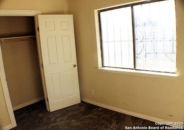 unfurnished bedroom featuring a closet