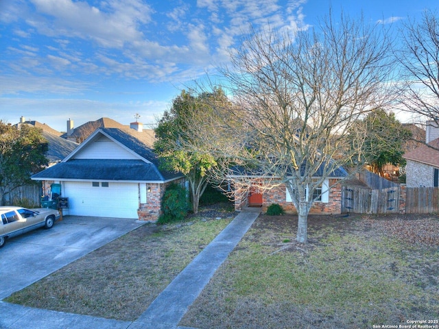 view of front facade with a front lawn and a garage