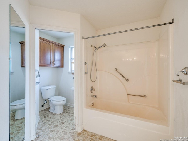 bathroom with toilet and shower / bathtub combination